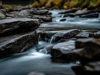 Water cascades over rocks in a river, long exposure