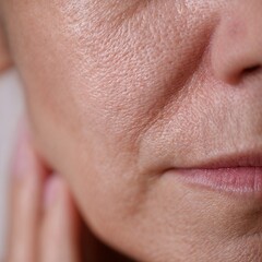 Obraz premium Close-up of aging skin texture and facial wrinkles