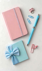 Pastel pink notebook blue pen gift box stationery flatlay