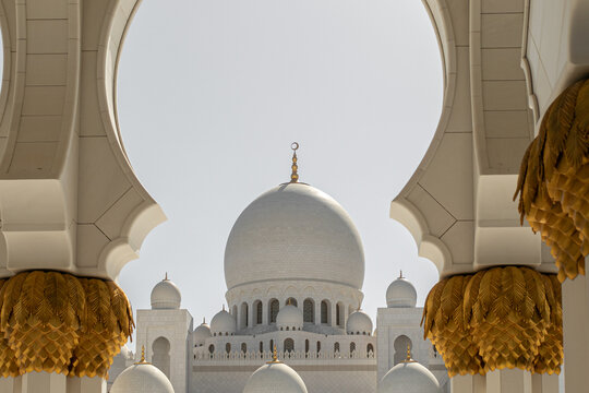 Sheikh Zayed Grand Mosque domes framed by ornate Islamic architecture in Abu Dhabi