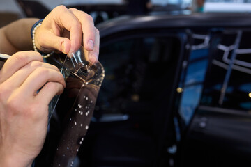 Applying a Protective Film on the Surface of Your Car for Enhanced Durability and Shine