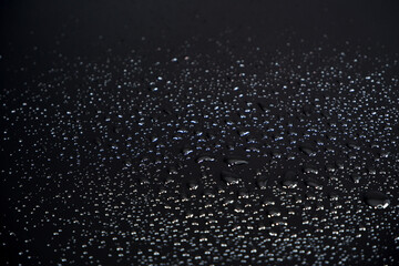 water drops on black background closeup view 