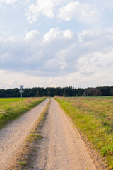 Country Road Under Cloudy Sky