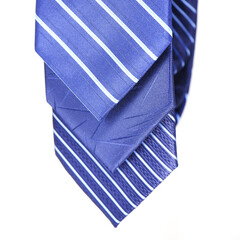 blue pattern neckties rolled together on white background, tie macro photography 