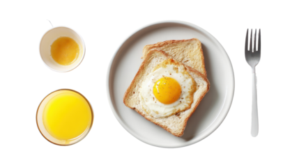 Breakfast plate with fried egg on toast, orange juice, and a cup of egg yolk.