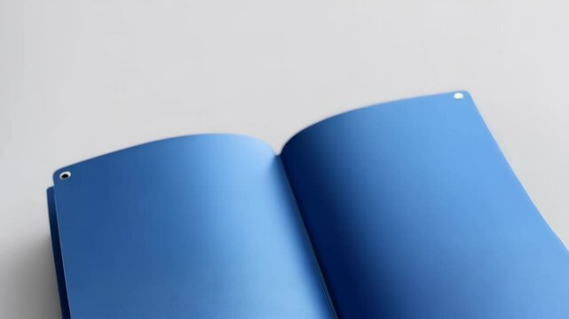 Open blue file folder with sheets of paper on a bright background with metal rings, document organization and storage