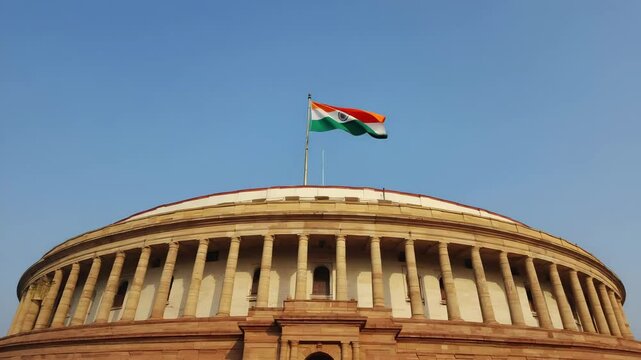 Indian National Flag Waving atop the Parliament House in New Delhi, India
