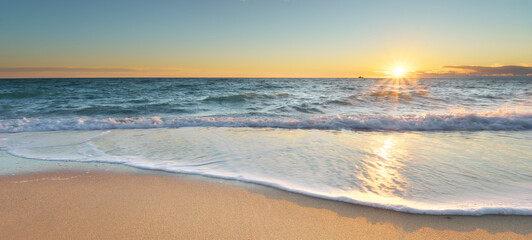 Sandy beach at sunset.