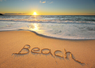 Beach word on the sea shore during the sunset.