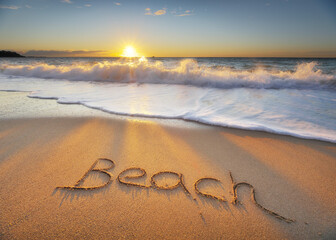 Beach word on the sea shore during the sunset.