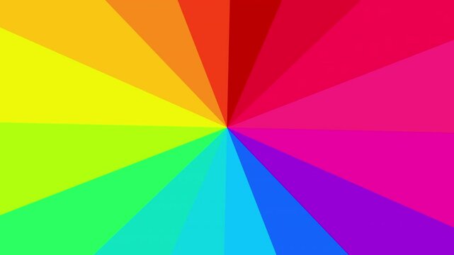 A vibrant radial burst of rainbow colors spinning from the center, creating a dynamic and abstract visual motion effect.
