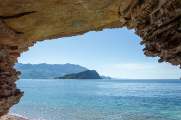 View from the cave to the Rocks, mountains and calm sea, Adriatic coast, copy space