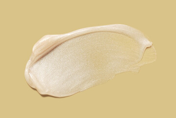 Glowing cosmetic white texture (lip gloss or mask or body lotion) isolated on white background