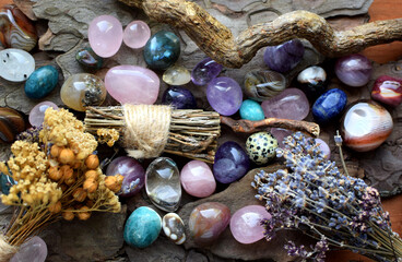 Beautiful natural stones amethysts, rose quartz, agates and dry herbs. Healing crystals....