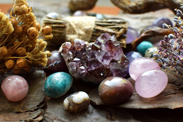Beautiful natural stones amethysts, rose quartz, agates and dry herbs. Healing crystals....