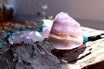 Beautiful natural fluorite stone on wooden background. Healing crystals. Predictions and magic.