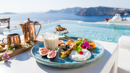 Enjoying a luxurious breakfast by the pool in Santorini with fresh figs and yogurt.