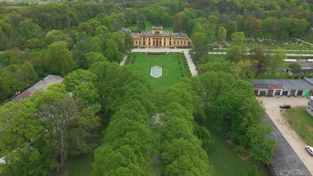 Drone footage of a Traku Voke Manor heritage museum in Vilnius, Lithuania with green lush landscape