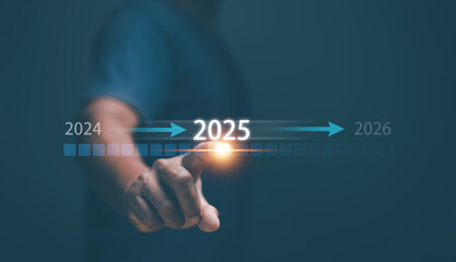 Progressing of financial concept. Hand touching on download bar status to change from 2024 to 2025 and business plan for 2026. Development to success motivation. Strategy for investment plan.
