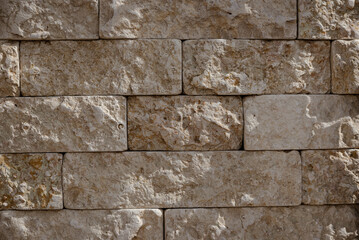 Stone wall texture. Fashionable background of a brick wall for designers. Bricks for facade decoration.
