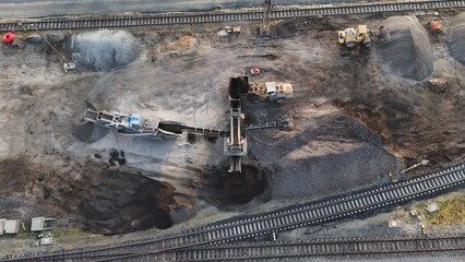 Aerial view of a loader feeding a screener with debris at a construction site. Industrial workflow...