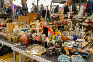 summer flea market and antique street sale in the Marais district in Paris , France