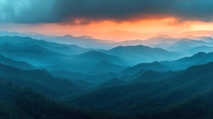 Fototapeta premium Majestic mountain range at sunrise. Vast, layered hills stretching into the horizon, bathed in warm sunset hues. Misty atmosphere adds depth and serenity to the scene
