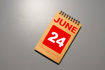 Vintage photo, June 24th. Date of 24 June on wooden cube calendar