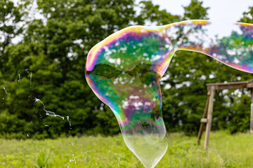 Colorful Soap Bubble Floating Outdoors in Nature