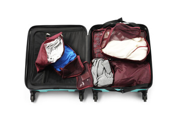 Open suitcase with packing cubes isolated on white, top view