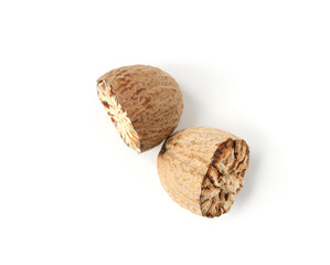 Halves of fresh nutmeg isolated on white, top view