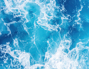 Vibrant ocean surface showcases mesmerizing blend of shimmering blue and white waves, creating captivating and dynamic scene that evokes sense of tranquility and wonder