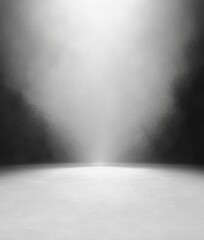 Empty studio space with spotlight shining down creating a bright illuminated area surrounded by shadows and gradient background