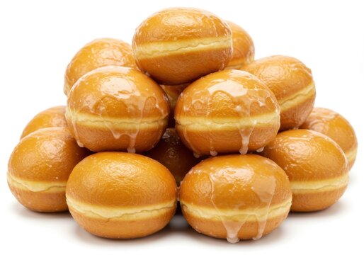 A pile of glazed donuts with cream filling on a plain white background view