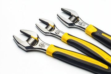 Obraz premium Adjustable wrenches with yellow and black handles.
