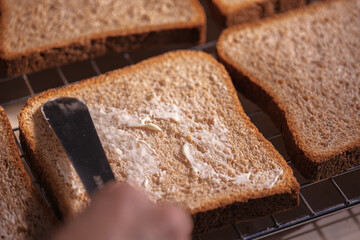 Spreading Butter on Slices of Bread