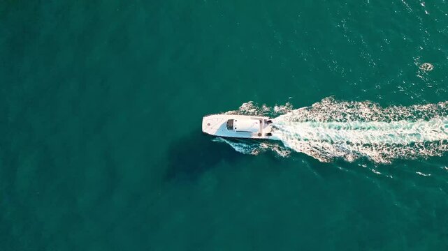 Sailing and yachting tourism. Luxury lifestyle. Summer vacation. Aerial top sea boat. Sailing at sea. Yacht top view. Motorboat sailing in sea. Boat going to yacht marina. Miami luxury charter