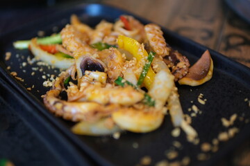 Octopus cooking, chef grill fresh octopus galician style on restaurant kitchen, healthy food, seafood cafe in spain, traditional asian japanese spanish and mediterranean dish. High quality 4k footage