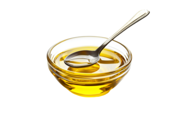 oil in glass bowl and spoon isolated on transparent background