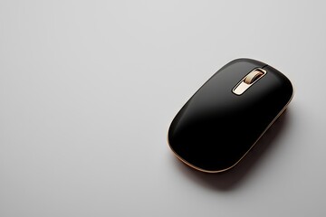 A glossy black computer mouse with gold accents.