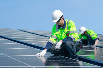 Engineer team installs solar cells check installation solar cell on the roof Sustainable energy industry concept Renewable energy solutions for climate change.