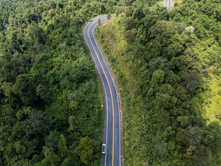 Aerial view of the road cutting through mountains on the way from Phayao province to Nan province, Thailand.