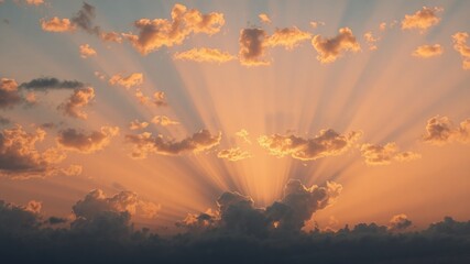 Golden sun rays burst through fluffy clouds at sunset creating a breathtaking and peaceful celestial scene of hope.