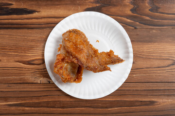 top view deep fried chicken wing on a dish at horizontal composition