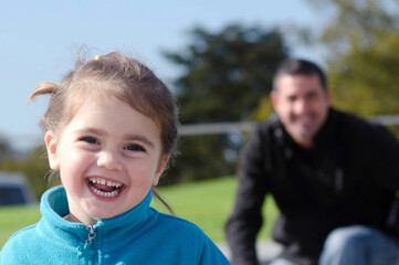 Young girl play with father