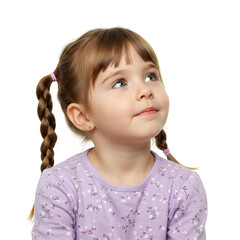 Curious young girl with pigtails looking upwards in wonder and amazement