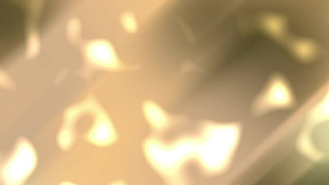 Blurred golden light background ideal for luxury branding, festive designs, holiday themes, and elegant backgrounds in commercial and graphic projects.