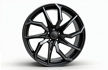 Obraz premium Modern black alloy wheel isolated on white background. New alloy rim for a car, transportation vehicle. Stylish disc for auto, isolated from other objects. Automobile industry, car service.