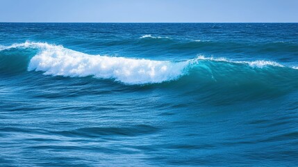 Fototapeta premium Serene Ocean Waves with Teal Accents Under Clear Blue Sky