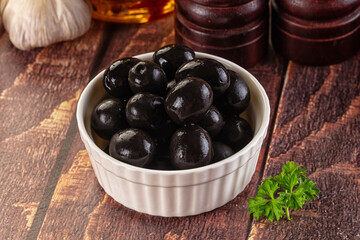 Mediterranean marinated Black olives in the bowl